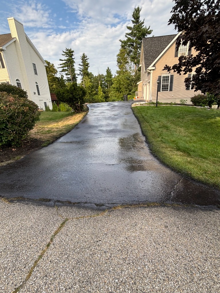 Completed long residential driveway sealcoating project